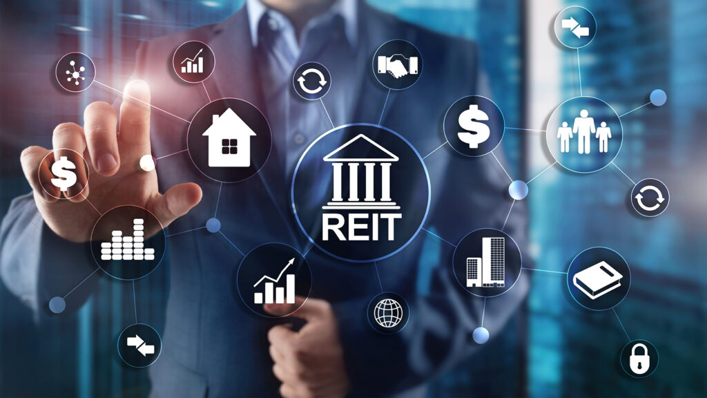 Image of person selecting real estate investment trust (REIT) financial options